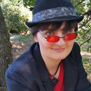 A photograph of Dorian Graves in an autumnal forest.